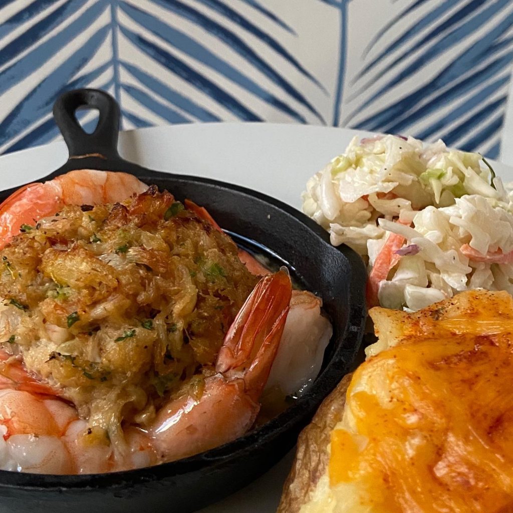 Trellis House crab cake stuffed colossal shrimp with twice baked and famous coleslaw.
